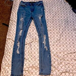 Girls, blue, ripped, skinny jeans.